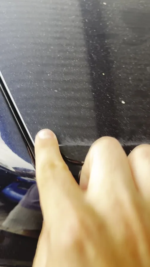 Close view of the unwashed BMW 740d surface during the inspection